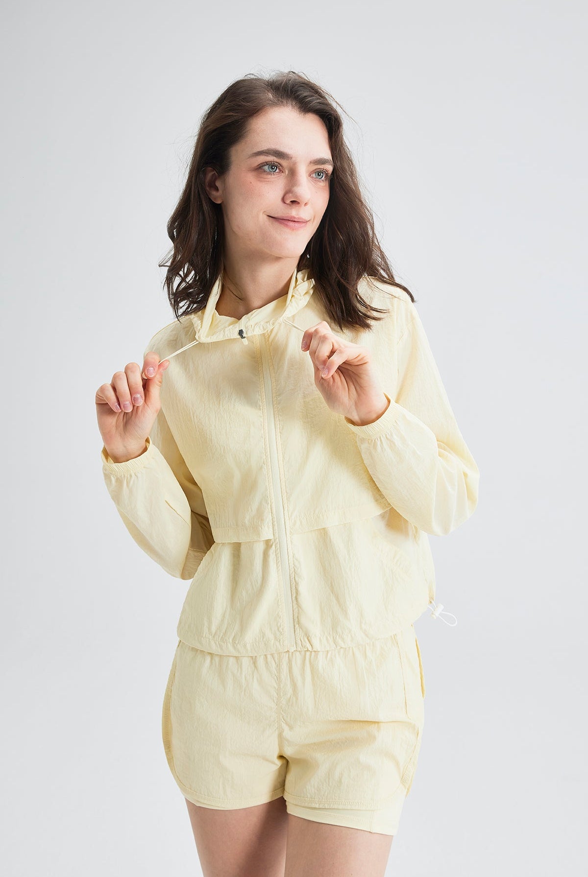 Woman wearing a SALTUM UPF 50+ sun protection jacket outdoors