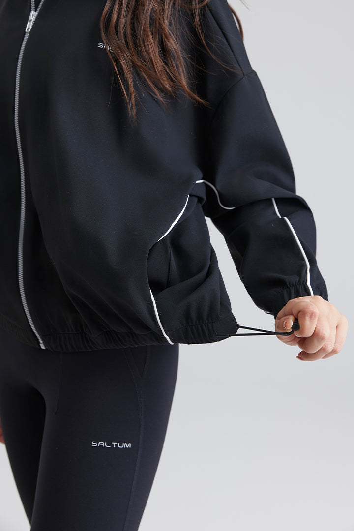 Saltum black tracksuit with white piping and adjustable hem