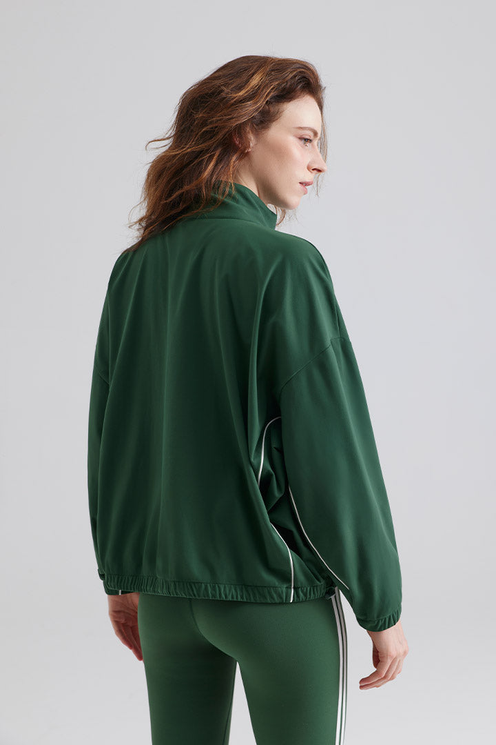 Woman green jacket and leggings for sports