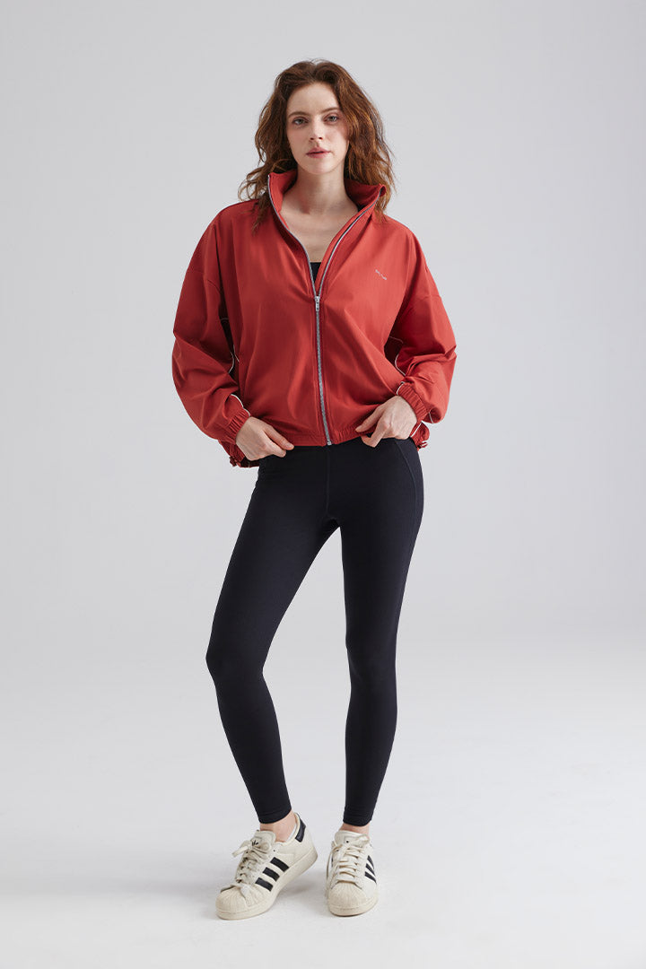 Woman red jacket and black leggings