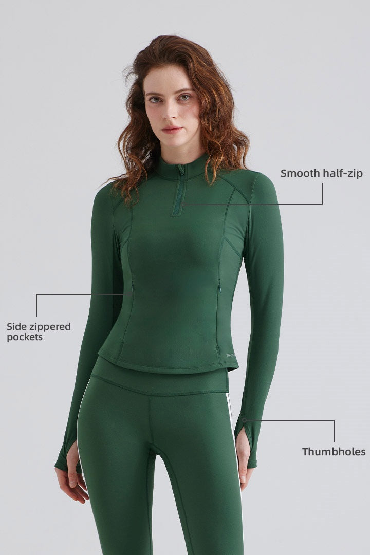 Woman green long-sleeve top with zippered pockets and thumbholes