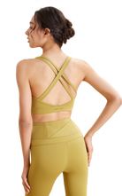 Woman yellow sports Criss Cross bra and leggings 