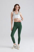Woman white sports ladies athletic tops and green leggings 