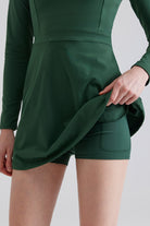 Green tennis dress with long sleeves and hidden shorts