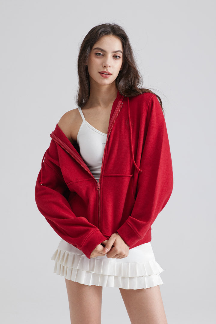 Woman Burgundy jacket over a white top and skirt