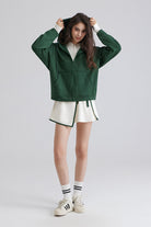 Saltum Women green jacket and white shorts