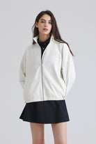 Woman white jacket over a black outfit