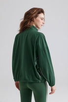 Woman green jacket and leggings for sports