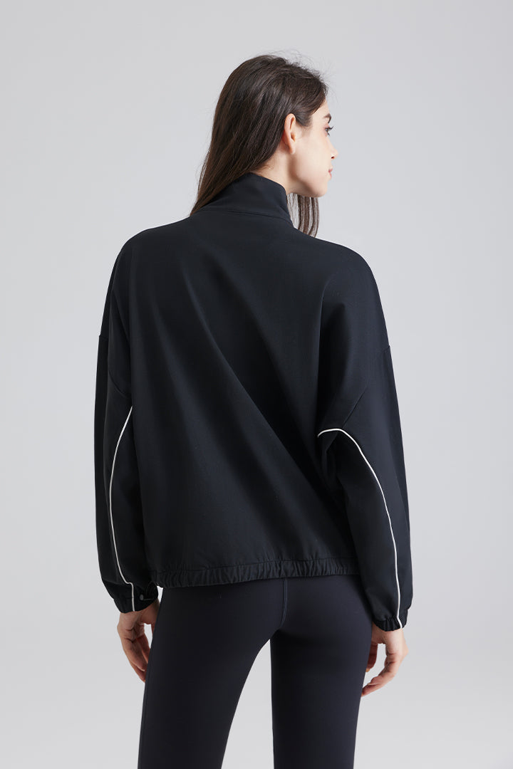 black jacket with white piping and pockets