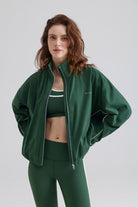 Woman green athletic jacket with pockets and leggings 
