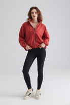 Woman red jacket and black leggings