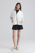 women white jacket and black skirt