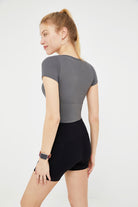 Woman gray athletic top and black shorts High Waist Seamless Biker Shorts Yoga Pant 