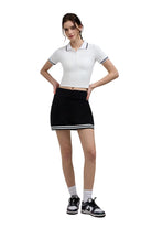 Woman white polo shirt and black skirt Golf Skort 