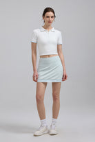 Woman white polo shirt and light blue skirt Island Club Mini Skirt
