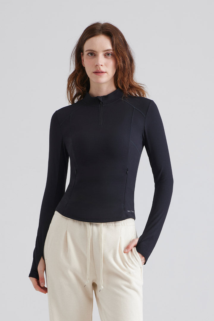 Woman black long-sleeve top and white pants with drawstring