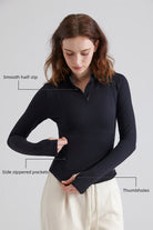 Woman black long-sleeve zip up top with Secure Pockets 