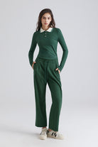 Woman green long-sleeve polo shirt and matching pants