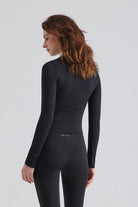 Woman black long-sleeve top and leggings Matching Sets