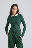 Woman green long-sleeve polo shirt with a white collar and green pants