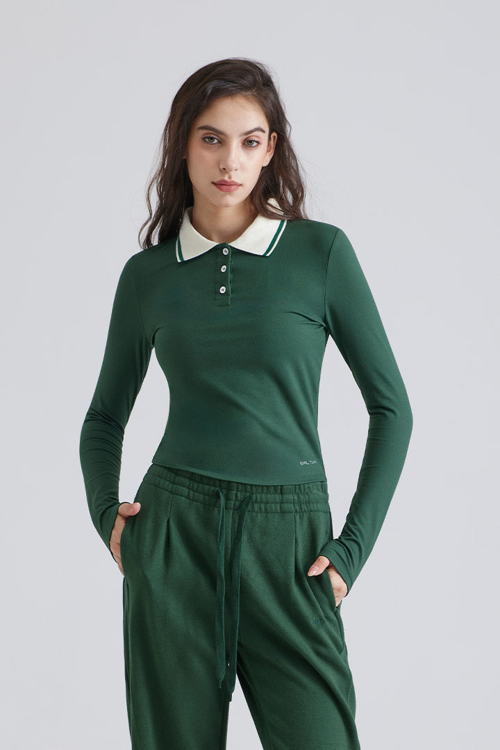 Woman green long-sleeve polo shirt with a white collar and green pants