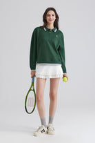 Woman relaxed green polo shirt and white Tennis skirt
