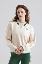 Woman white sweater with a collar and green pants Polo Sweater