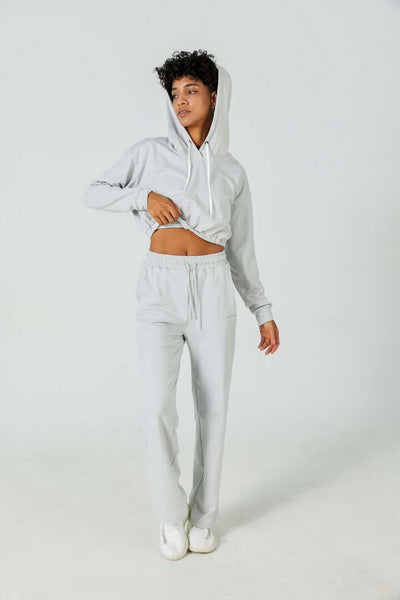 Person wearing CloudFleece™ Wide Leg Sweatpant in light flecked grey with adjustable waistband and deep side pockets for casual comfort.